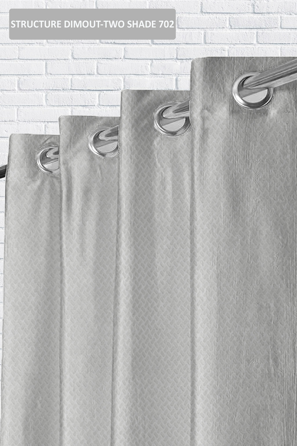 Gray shower curtain with hooks on a tiled wall background