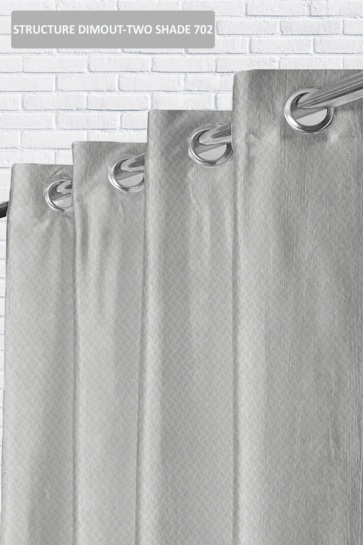 Gray shower curtain with hooks on a tiled wall background